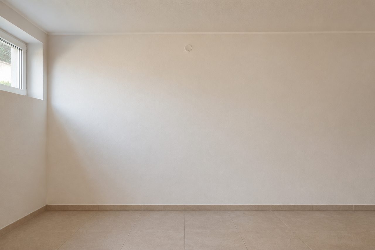 Kellerwand mit unauffälligem Luftdurchlass